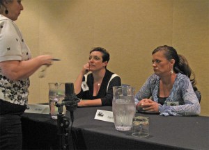 Jill Marr (seated left) and Cari Foulk listening to a question at Killer Nashville 2010.