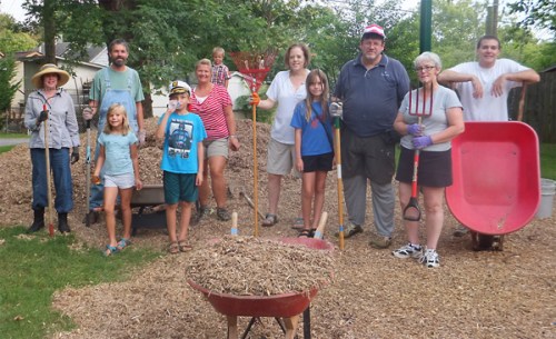 It takes a village to mulch a park.