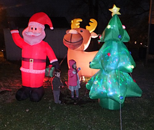 Discussing the ramifications of an inflatable Christmas with her little brother.