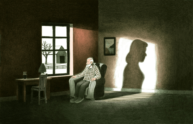 Man sitting alone in a chair, looking out a window.
